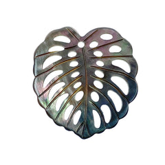 A heart-shaped black mother of pearl bead with a leaf pattern design, with a mix of dark and light brown colors.
