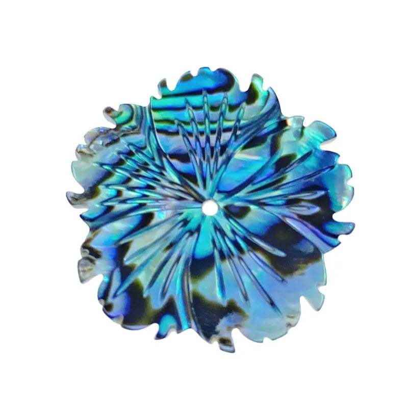 Decorative glass piece with blue and green patterns on a white background