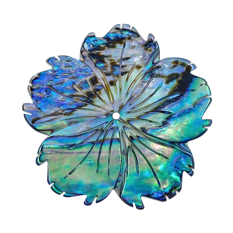 A hand-carved abalone shell flower bead with a natural color pattern resembling a hibiscus flower.