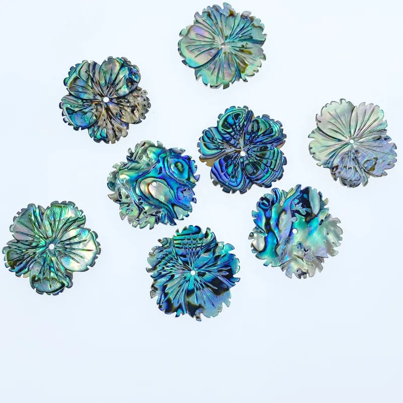 Set of colorful shell-like decorative items on a light blue background