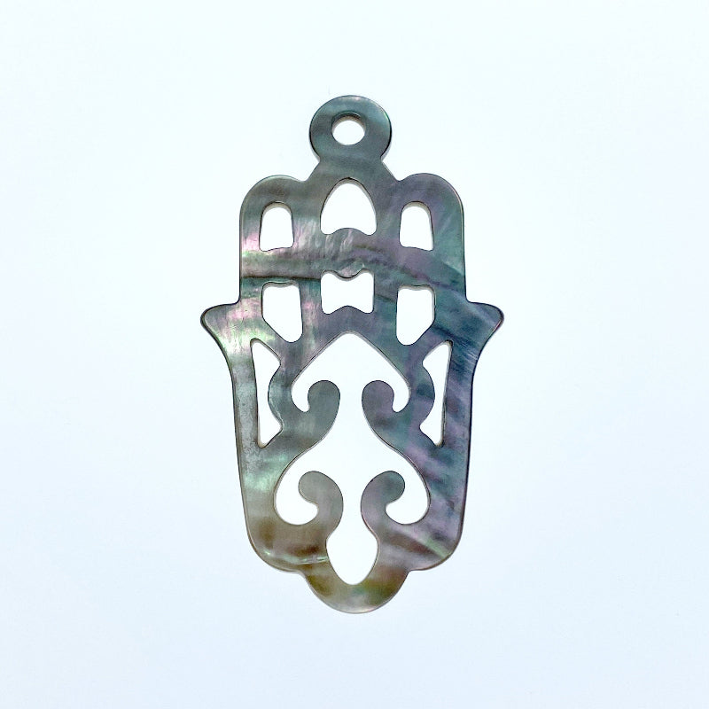 A black mother of pearl filigree hamsa hand pendant with a smooth, polished finish.