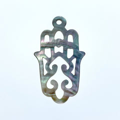 A black mother of pearl filigree hamsa hand pendant with a smooth, polished finish.