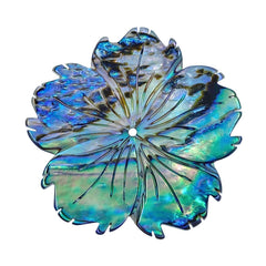 A hand-carved abalone shell flower bead with a natural color pattern resembling a hibiscus flower.